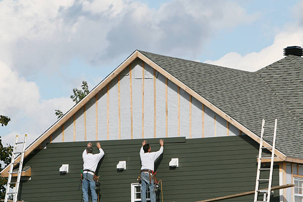 Professional Storm Damage Siding Repair technician working in Fairhope, PA